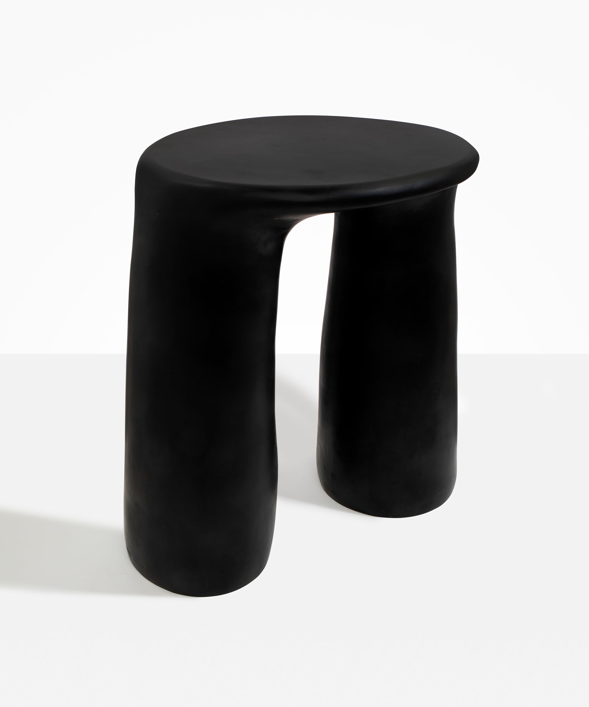 Dinosaur Designs Rock Tower Table in Black — handcrafted black resin side table with oval top and two chunky rounded legs