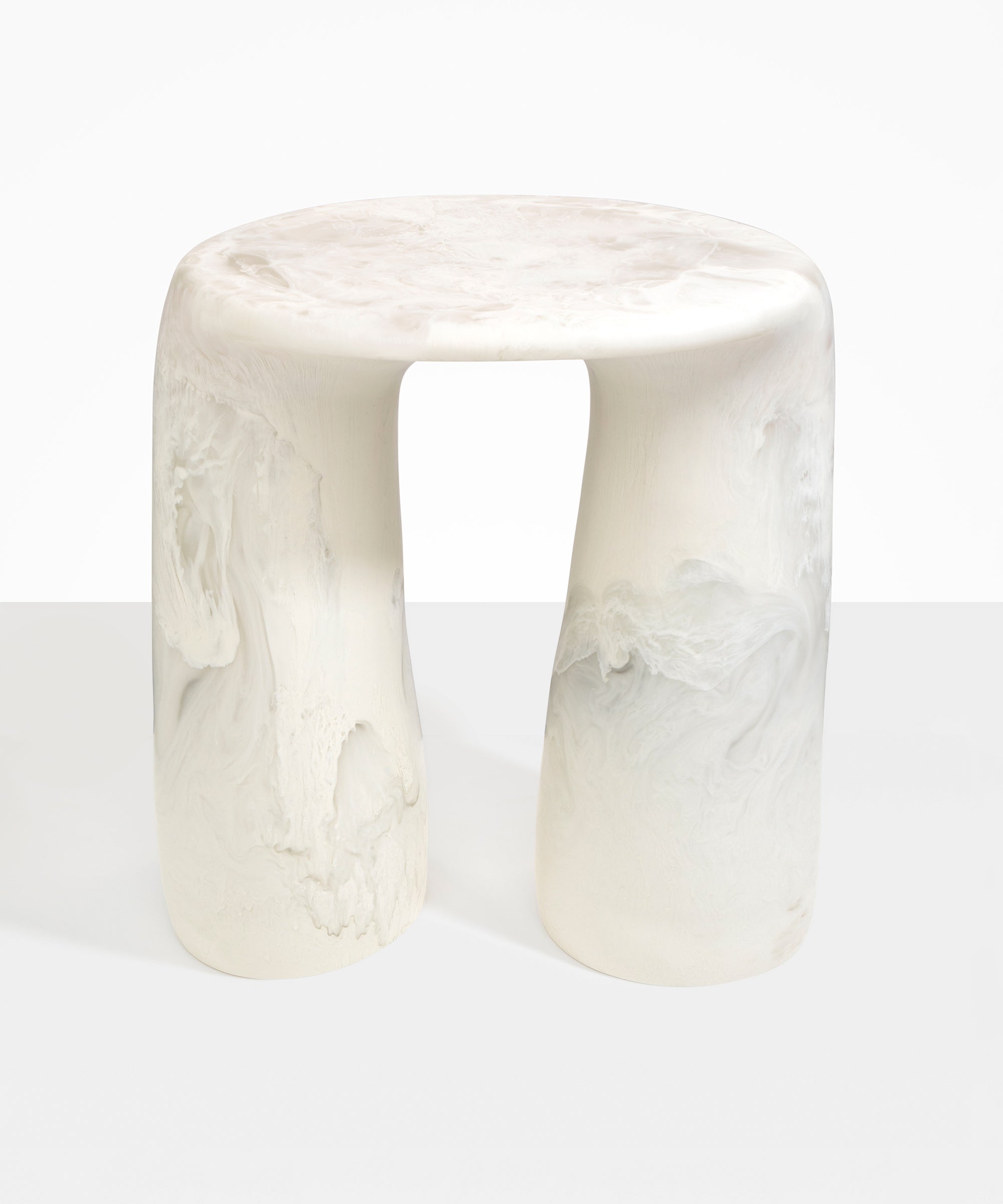 Dinosaur Designs Rock Tower Table in Chalk Swirl — handcrafted marbled off white and clear resin side table with oval top and two chunky rounded legs..