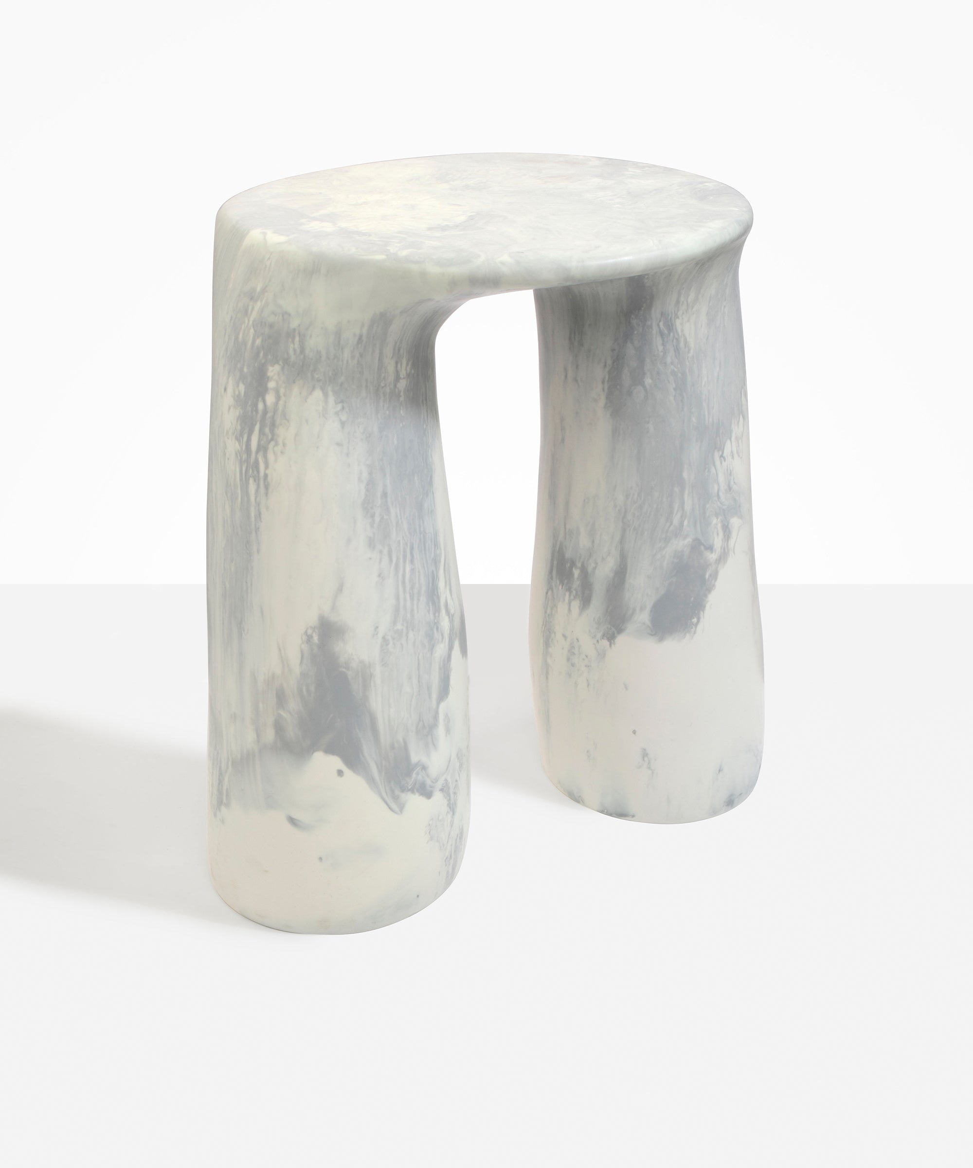 Dinosaur Designs Rock Tower Table in Cloud — handcrafted marbled grey and cream resin side table with oval top and two chunky rounded legs..