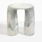 Dinosaur Designs Rock Tower Table in Cloud — handcrafted marbled grey and cream resin side table with oval top and two chunky rounded legs..