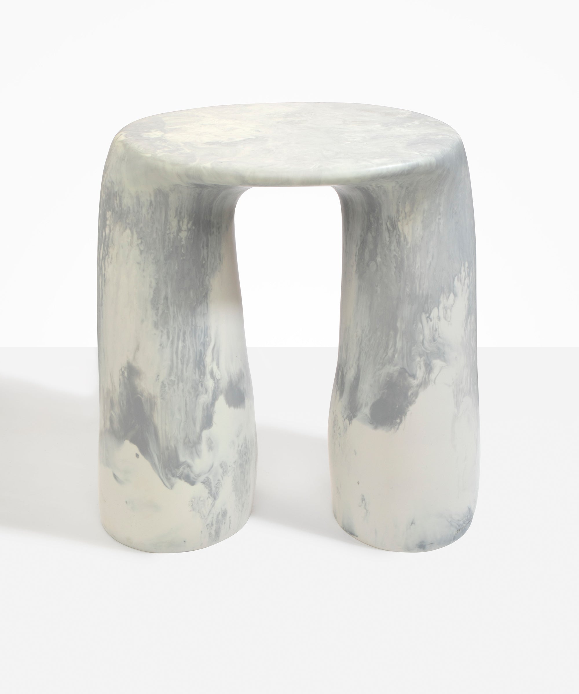 Dinosaur Designs Rock Tower Table in Cloud — handcrafted marbled grey and cream resin side table with oval top and two chunky rounded legs..