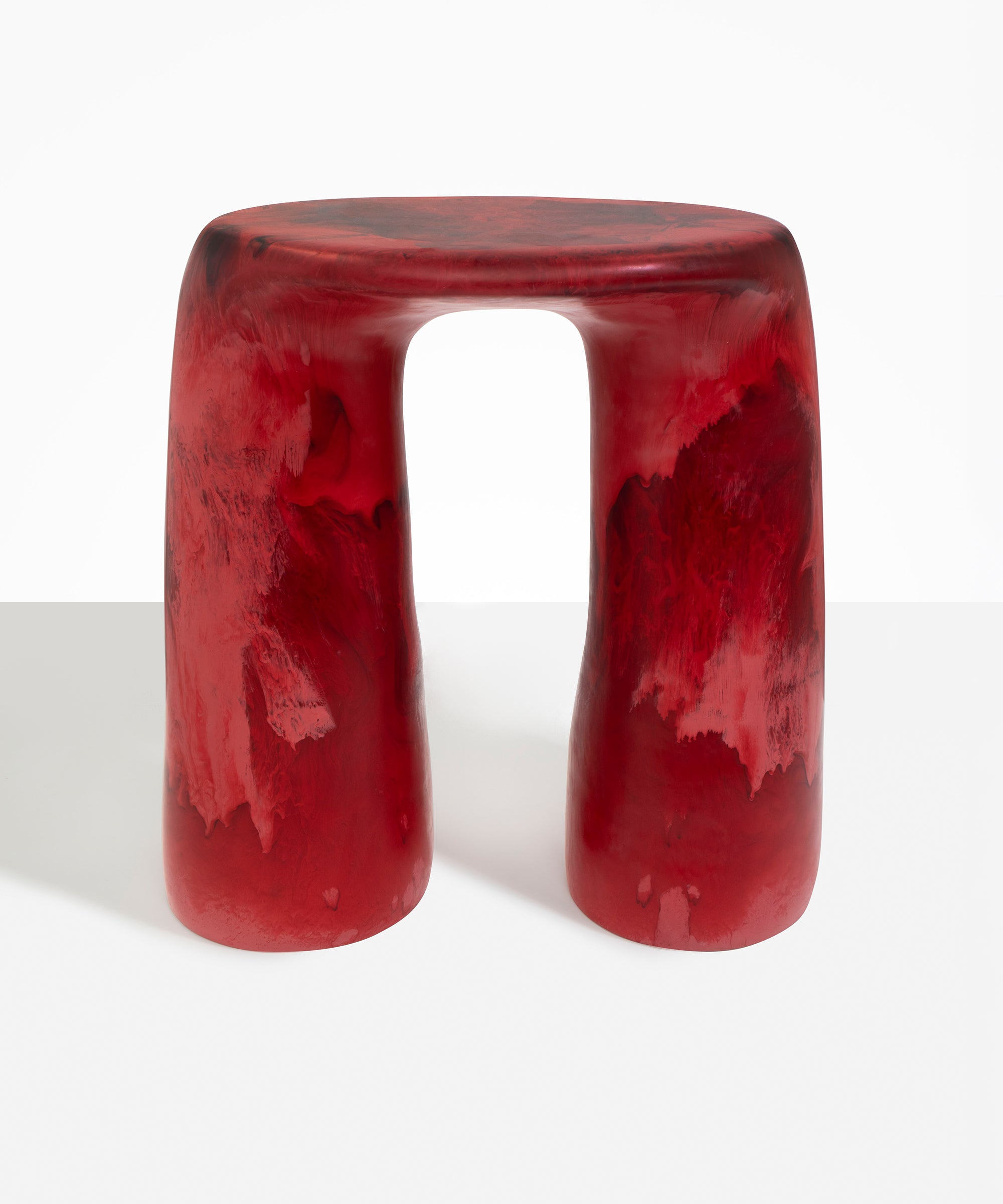 Dinosaur Designs Rock Tower Table in Cranberry — handcrafted marbled red resin side table with oval top and chunky rounded legs