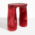 Dinosaur Designs Rock Tower Table in Cranberry — handcrafted marbled red resin side table with oval top and chunky rounded legs