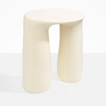 Dinosaur Designs Rock Tower Table in Cream — handcrafted cream resin side table with oval top and two chunky rounded legs