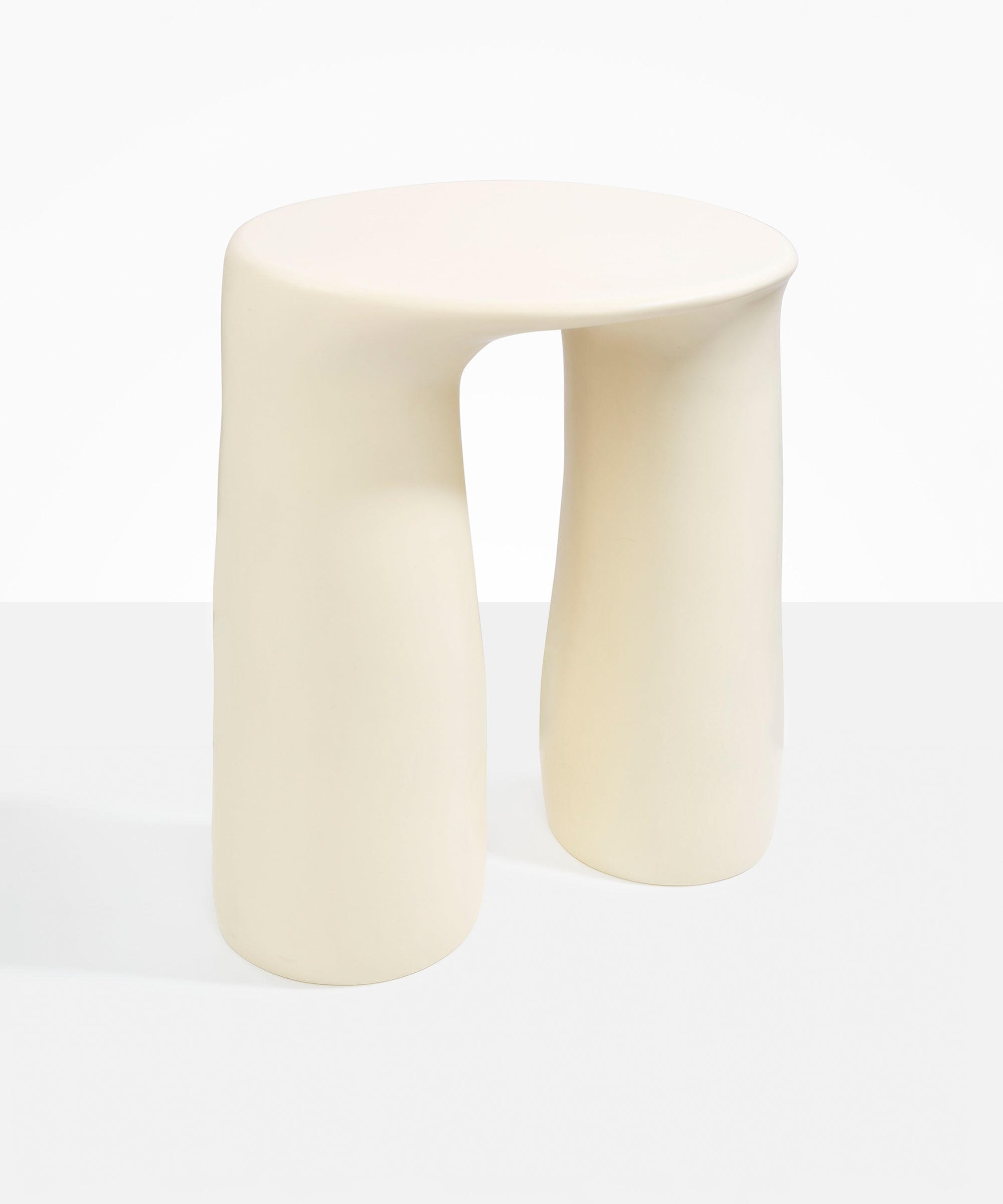 Dinosaur Designs Rock Tower Table in Cream — handcrafted cream resin side table with oval top and two chunky rounded legs