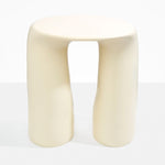 Dinosaur Designs Rock Tower Table in Cream — handcrafted cream resin side table with oval top and two chunky rounded legs..