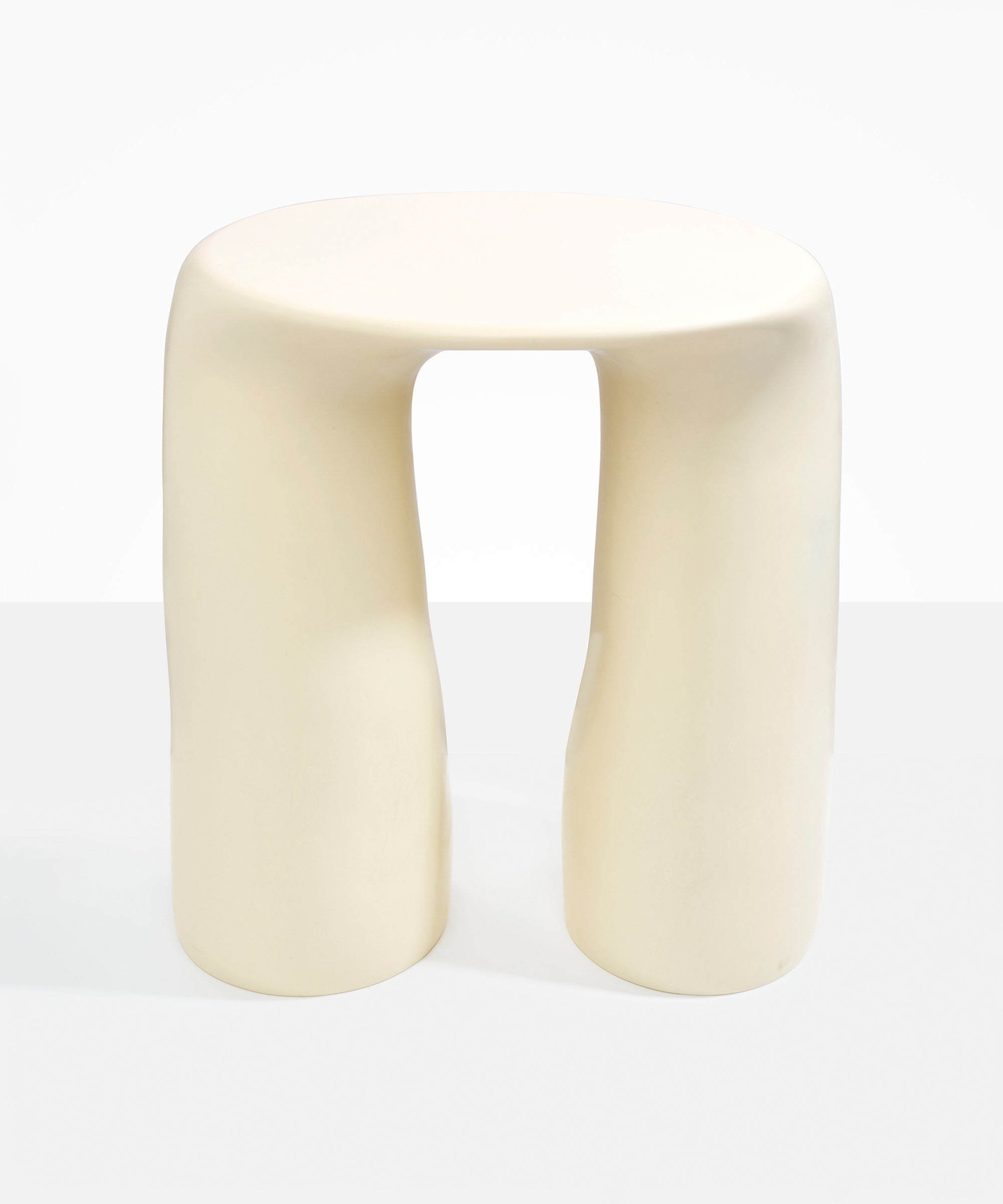 Dinosaur Designs Rock Tower Table in Cream — handcrafted cream resin side table with oval top and two chunky rounded legs..