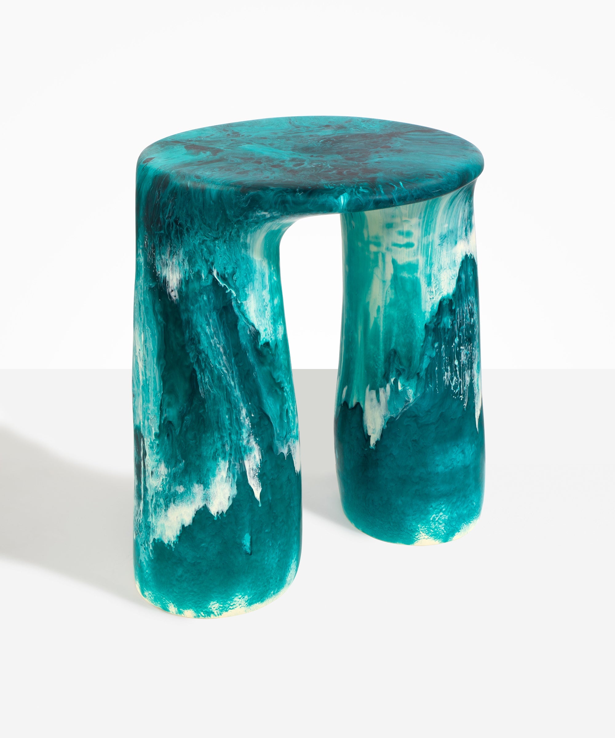 Dinosaur Designs Rock Tower Table in Lagoon — handcrafted marbled blue and cream resin side table with oval top and two chunky rounded legs..