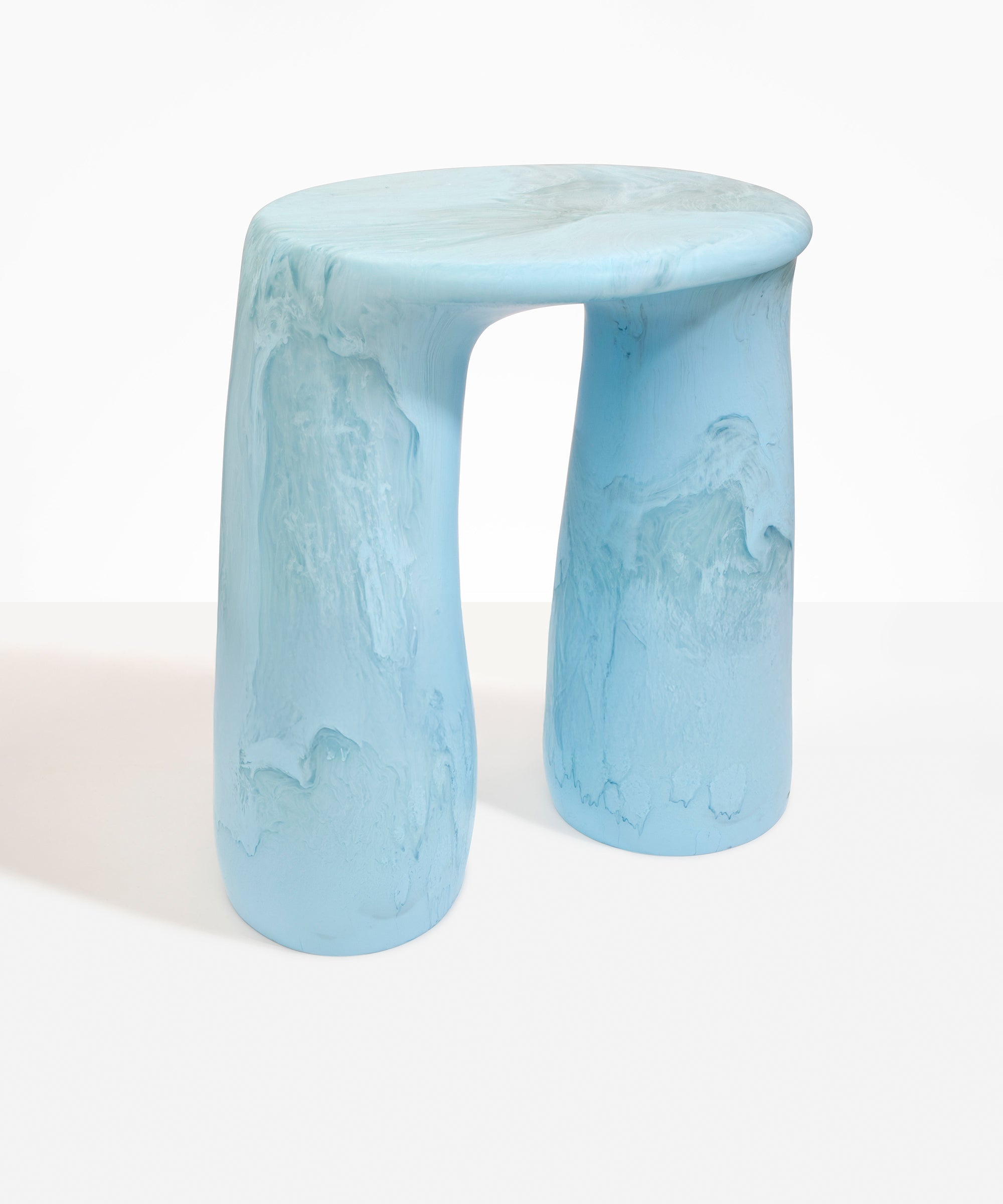 Dinosaur Designs Rock Tower Table in Pool — handcrafted marbled blue and clear resin side table with oval top and two chunky rounded legs