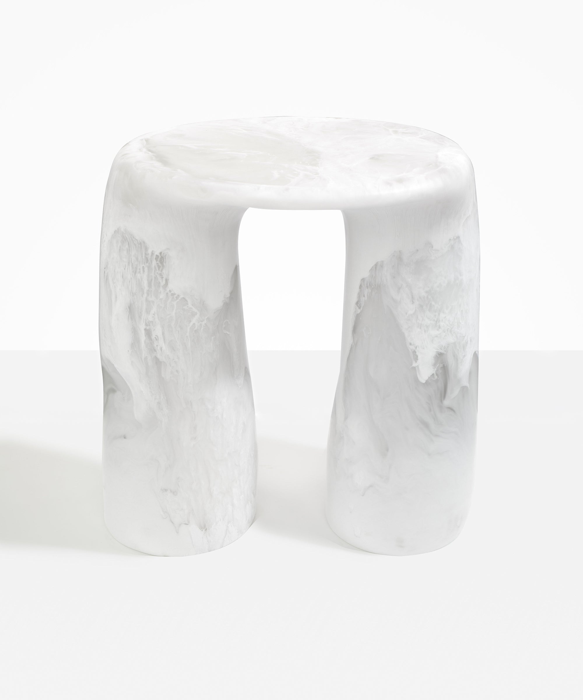 Dinosaur Designs Rock Tower Table in Snow Swirl — handcrafted marbled white and clear resin side table with oval top and two chunky rounded legs