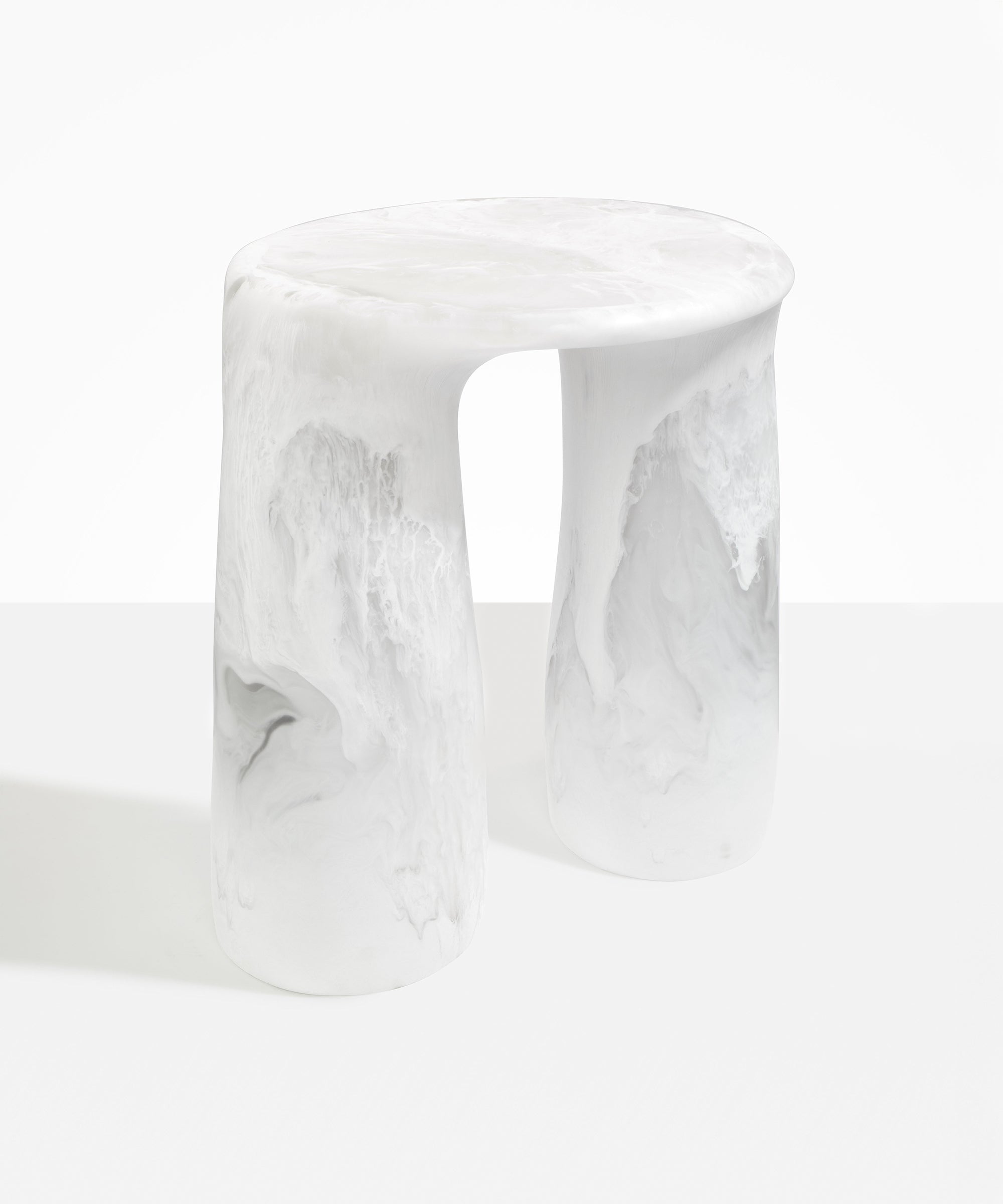 Dinosaur Designs Rock Tower Table in Snow Swirl — handcrafted marbled white and clear resin side table with oval top and two chunky rounded legs