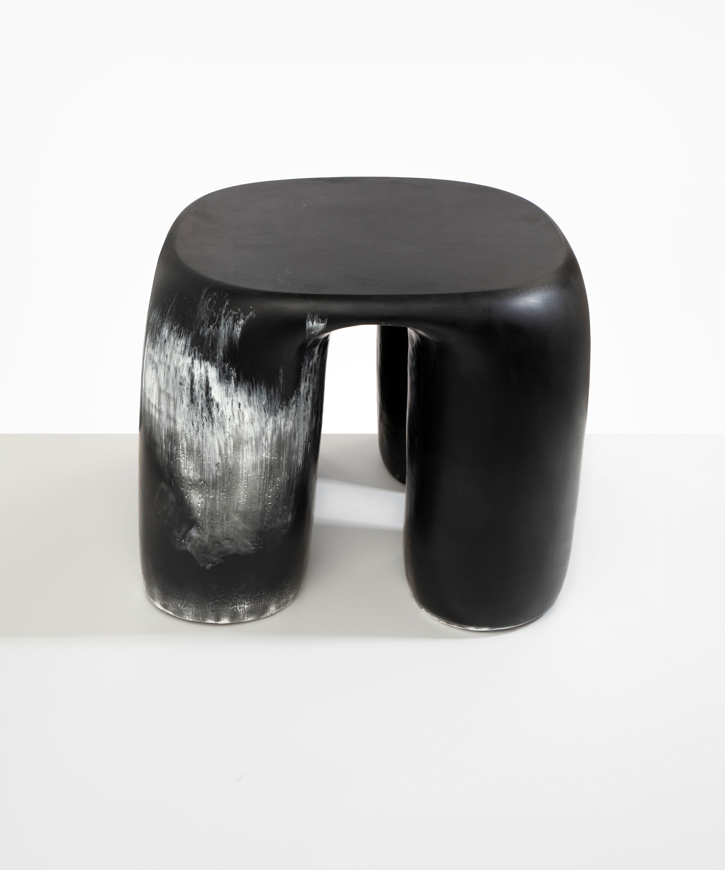 Dinosaur Designs 4-Leg Rock Tower Table in Black Marble — handcrafted marbled black and white resin side table with square top and four chunky rounded legs