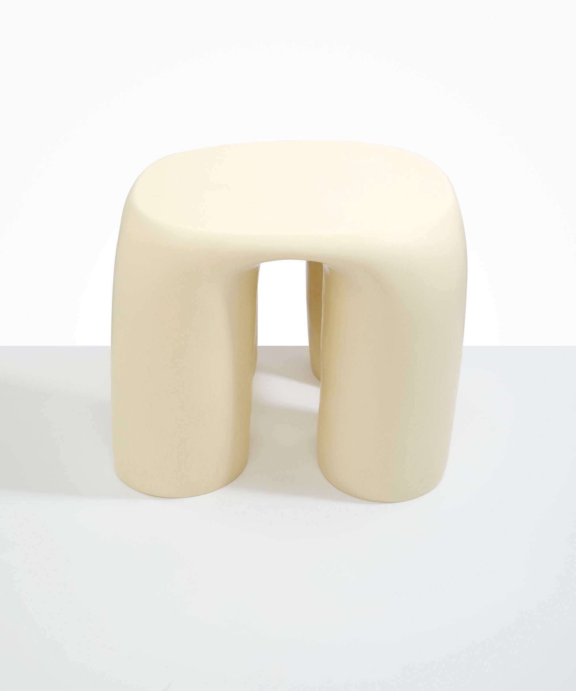 Dinosaur Designs 4-Leg Rock Tower Table in Cream — handcrafted cream resin side table with square top and four chunky rounded legs