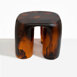 Dinosaur Designs 4-Leg Rock Tower Table in Tortoise — handcrafted marbled amber and black resin side table with square top and four chunky rounded legs..