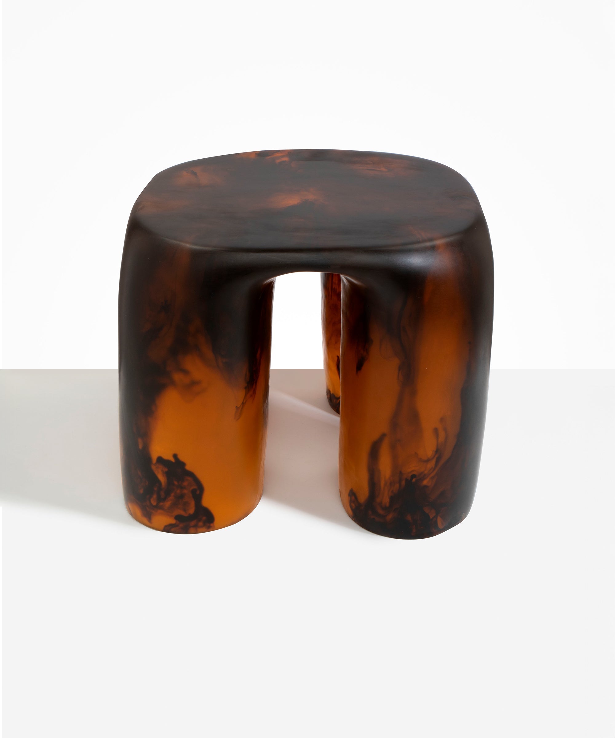 Dinosaur Designs 4-Leg Rock Tower Table in Tortoise — handcrafted marbled amber and black resin side table with square top and four chunky rounded legs..