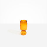 Dinosaur Designs Small Glass Rockpool Vase in Amber — handblown amber glass vase with rounded bulbous body and small spherical pedestal base..