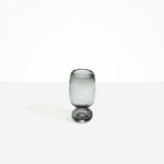 Dinosaur Designs Small Glass Rockpool Vase in Clear Black — handblown transparent black glass vase with rounded bulbous body and small spherical pedestal base..