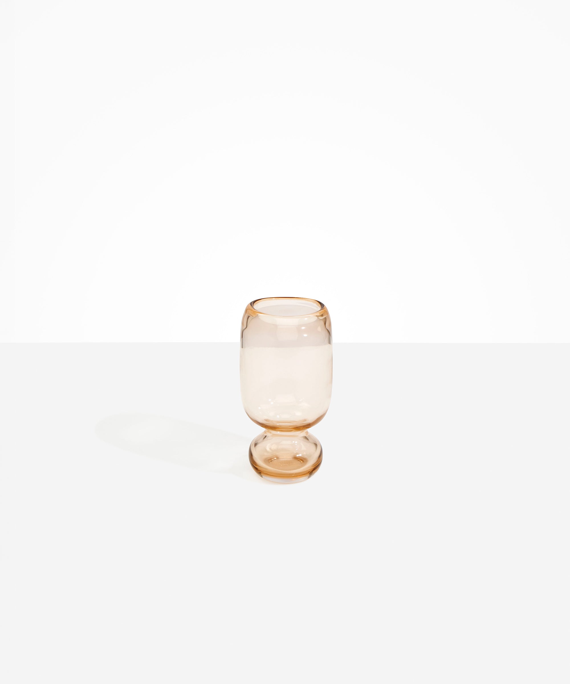 Dinosaur Designs Small Glass Rockpool Vase in Clear Brown — handblown transparent brown glass vase with rounded bulbous body and small spherical pedestal base..