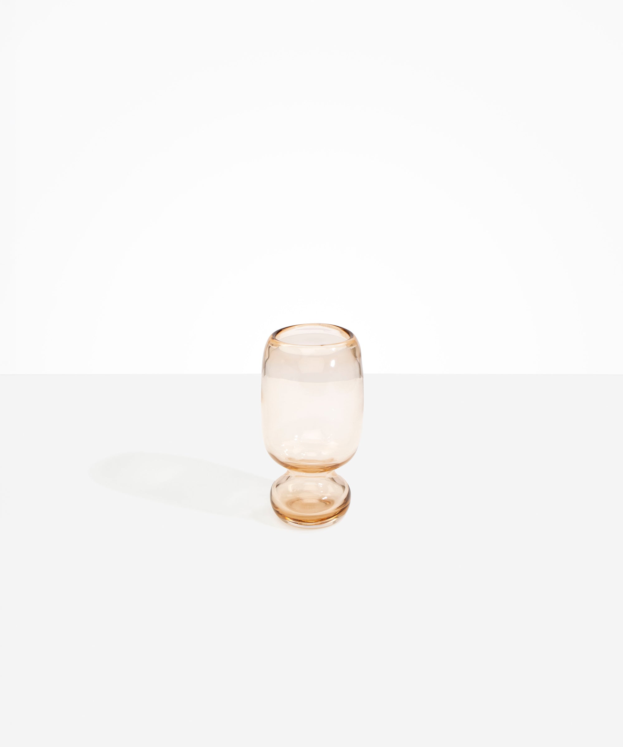 Dinosaur Designs Small Glass Rockpool Vase in Clear Brown — handblown transparent brown glass vase with rounded bulbous body and small spherical pedestal base..