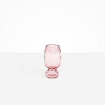 Dinosaur Designs Small Glass Rockpool Vase in Pink — handblown transparent pink glass vase with rounded bulbous body and small spherical pedestal base..