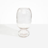 Dinosaur Designs Tall Glass Rockpool Vase in Clear — handblown transparent glass vase with rounded bulbous body and spherical pedestal base..