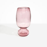 Dinosaur Designs Tall Glass Rockpool Vase in Pink — handblown transparent pink glass vase with rounded bulbous body and spherical pedestal base..