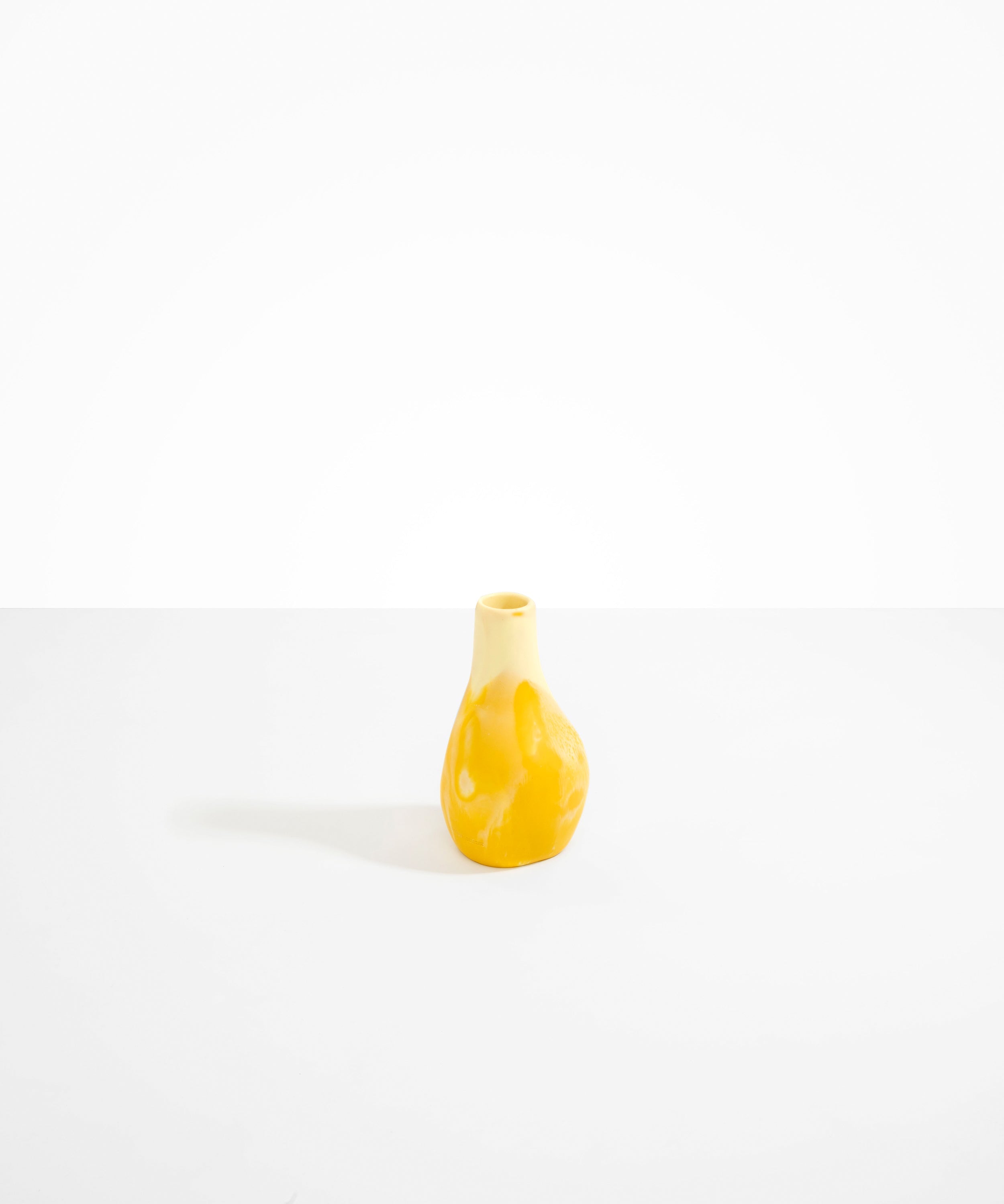Dinosaur Designs medium sized Liquid vase in daisy yellow colour resin..