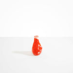Dinosaur Designs medium sized Liquid vase in daisy red and cream colour resin..