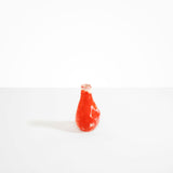 Dinosaur Designs medium sized Liquid vase in daisy red and cream colour resin