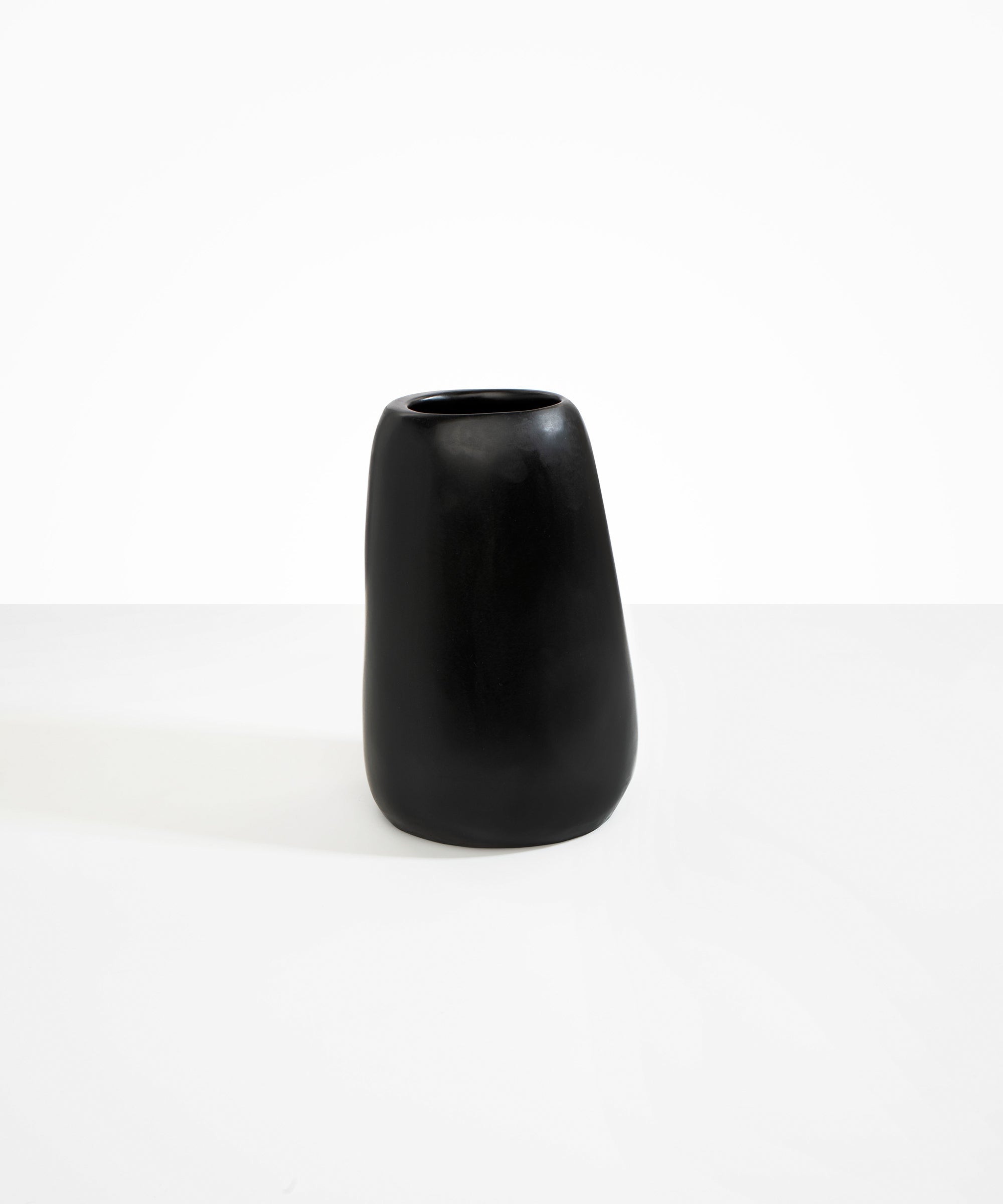 Dinosaur Designs Large Pebble Vase in Black — handcrafted black resin vase with smooth rounded pebble form and narrow opening