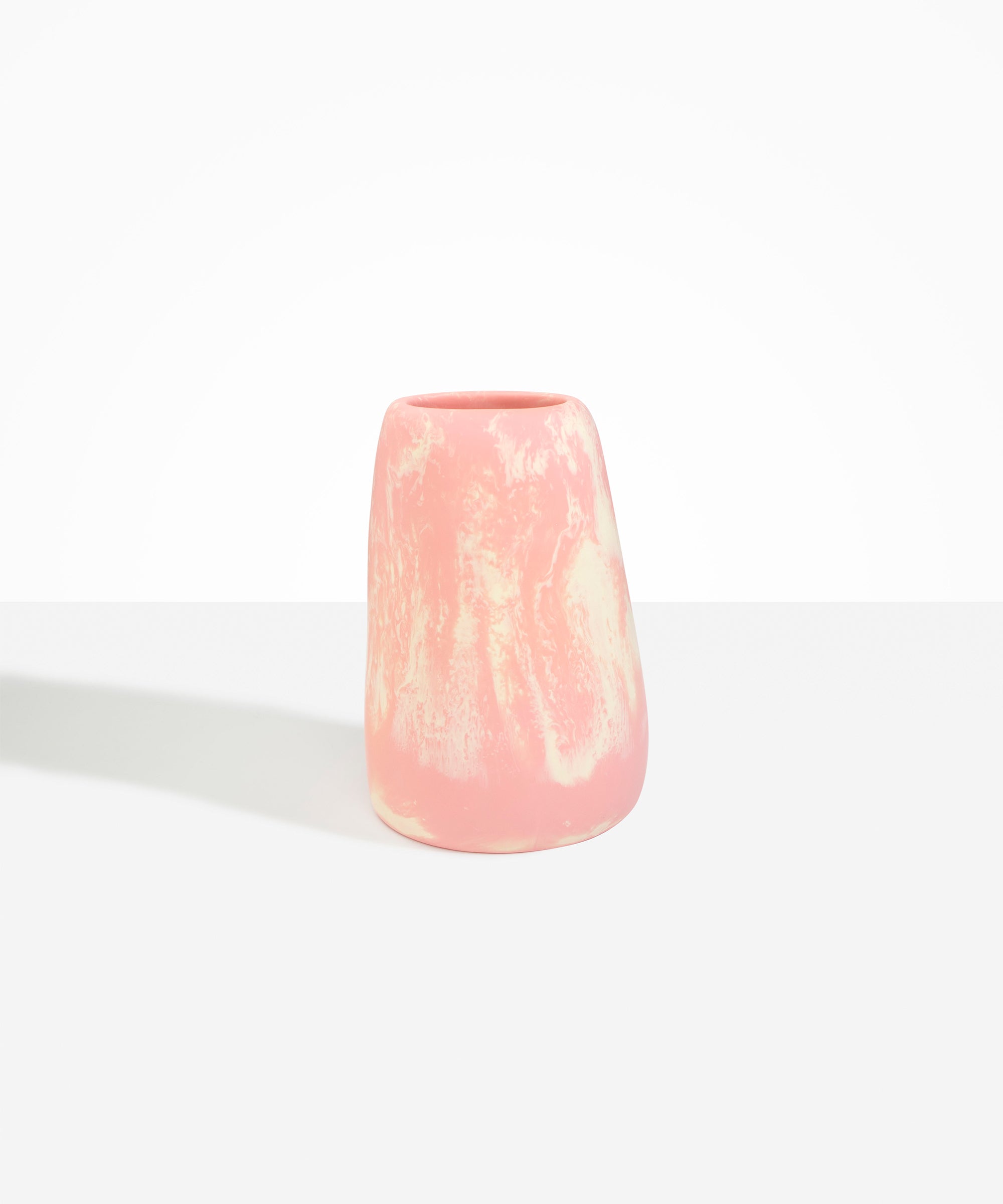 Dinosaur Designs Large Pebble Vase in Blossom — handcrafted marbled pink and cream resin vase with smooth rounded pebble form and narrow opening