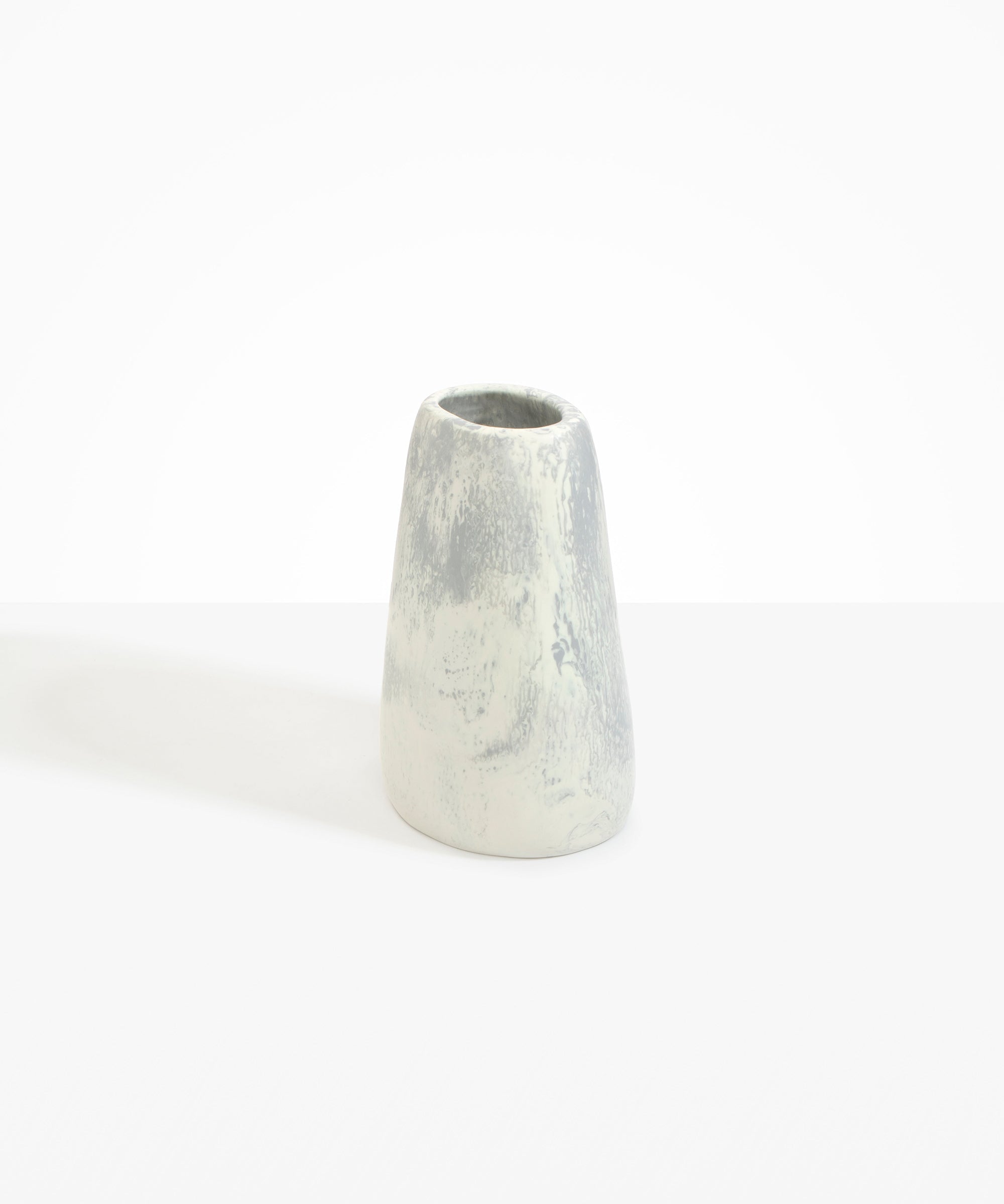 Dinosaur Designs Large Pebble Vase in Cloud — handcrafted marbled cream and grey resin vase with smooth rounded pebble form and narrow opening.