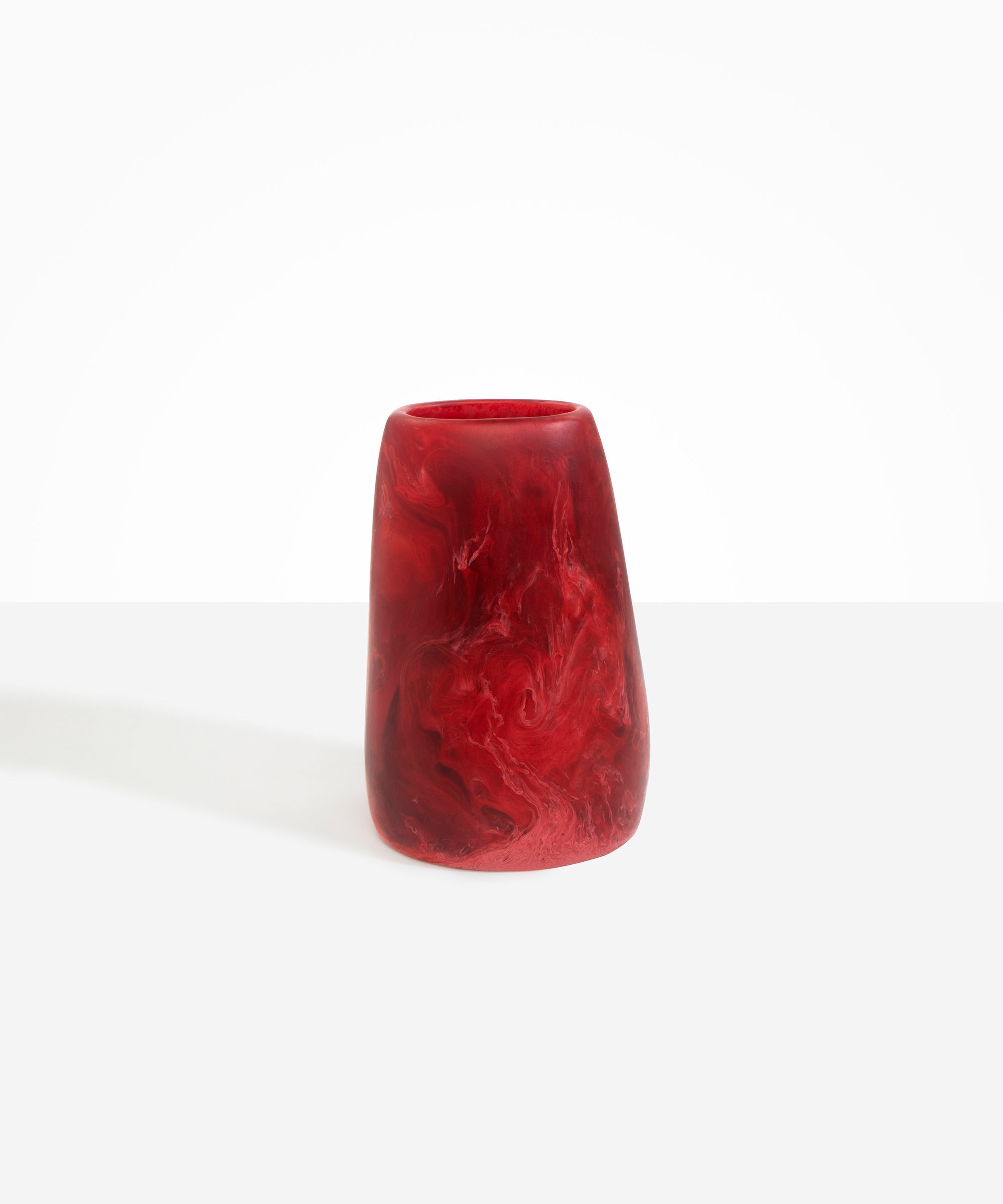 Dinosaur Designs Large Pebble Vase in Cranberry — handcrafted marbled red and transparent resin vase with smooth rounded pebble form and narrow opening