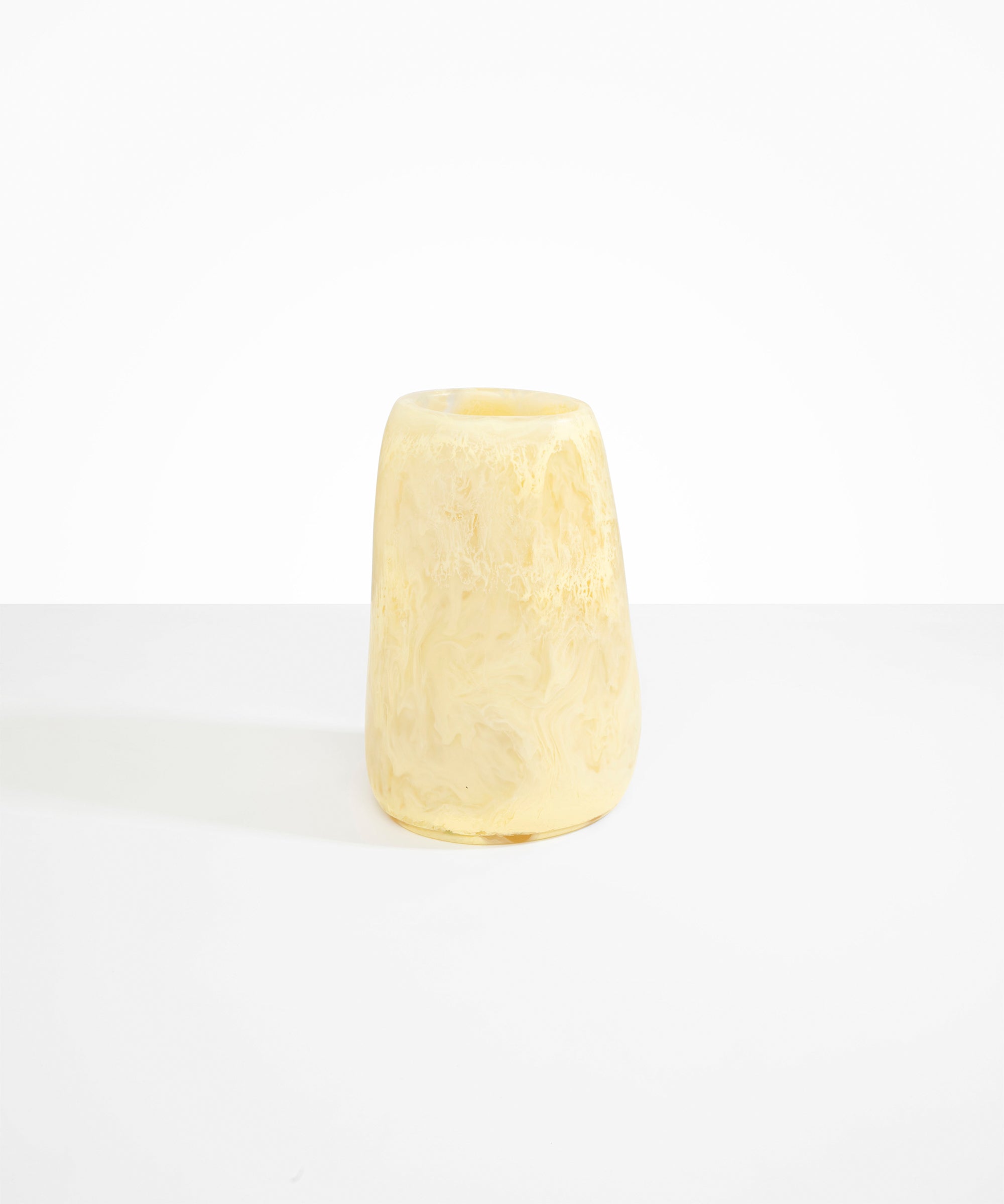 Dinosaur Designs Large Pebble Vase in Lemon — handcrafted marbled yellow and transparent resin vase with smooth rounded pebble form and narrow opening