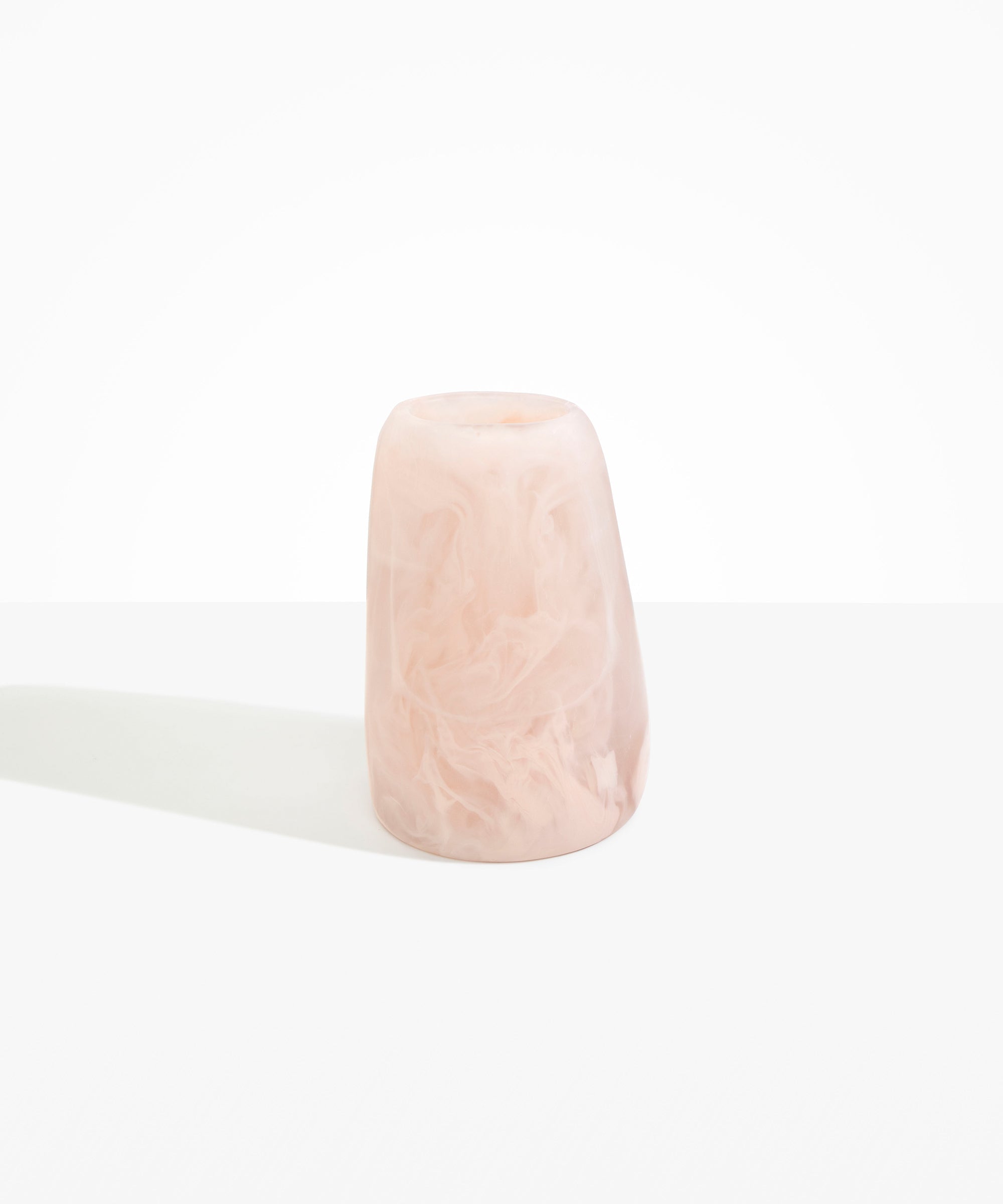 Dinosaur Designs Large Pebble Vase in Rose Swirl — handcrafted marbled pink and transparent resin vase with smooth rounded pebble form and narrow opening.