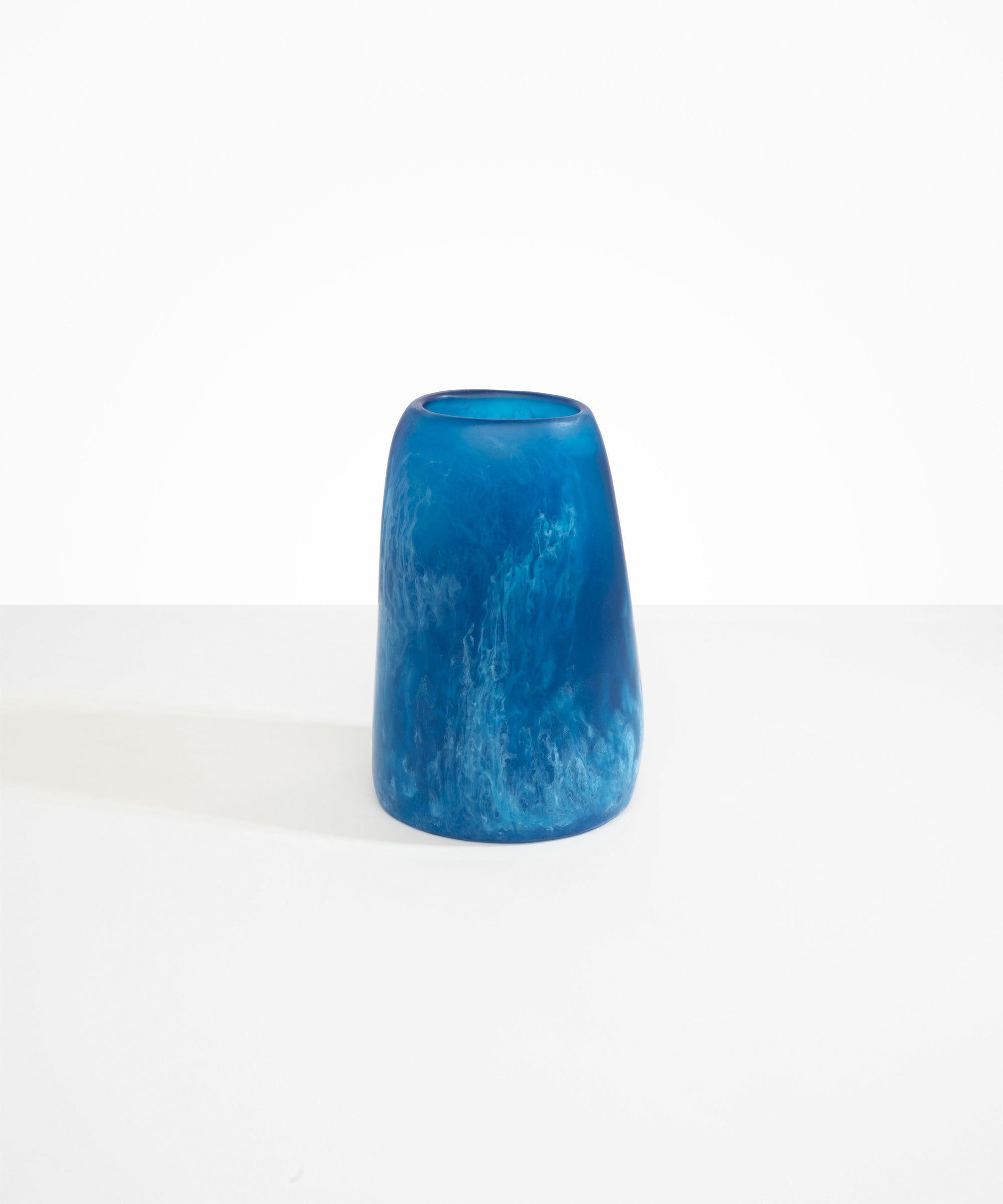 Dinosaur Designs Large Pebble Vase in Sky — handcrafted marbled blue and transparent resin vase with smooth rounded pebble form and narrow opening