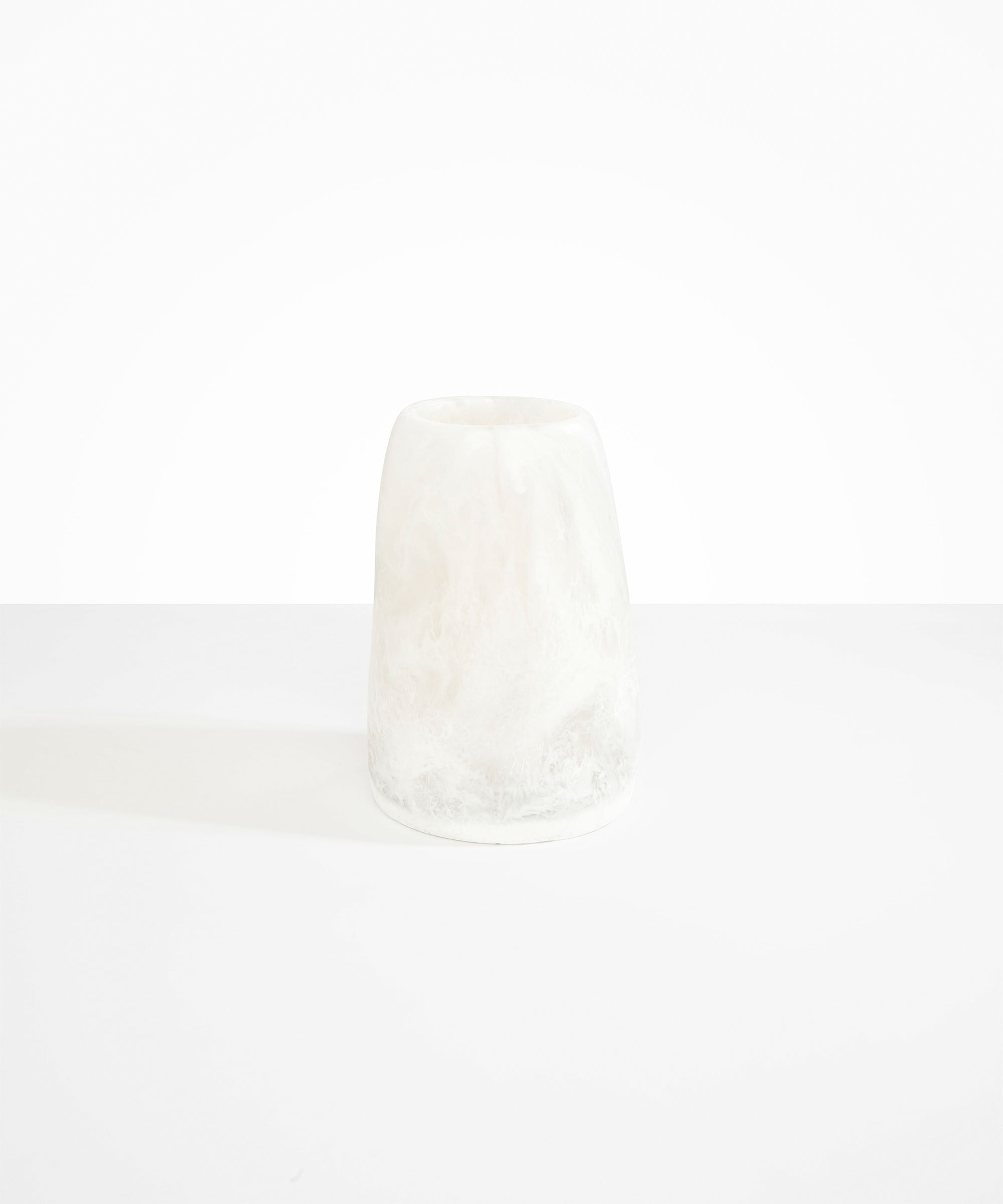 Dinosaur Designs Large Pebble Vase in Snow Swirl — handcrafted marbled white and transparent resin vase with smooth rounded pebble form and narrow opening