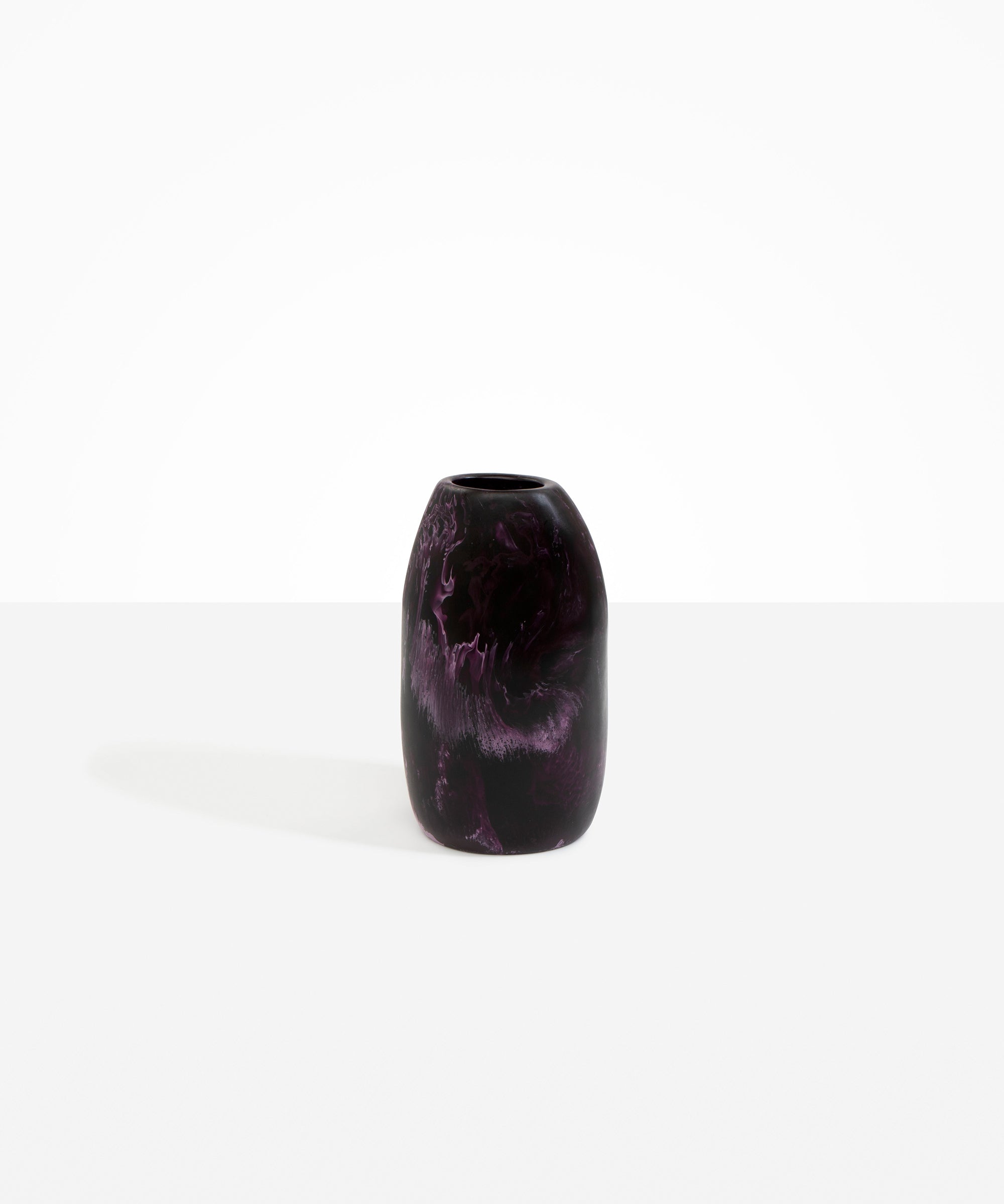 Dinosaur Designs Medium Pebble Vase in Dark Plum — handcrafted marbled dark purple and lilac resin vase with smooth rounded pebble form and narrow opening