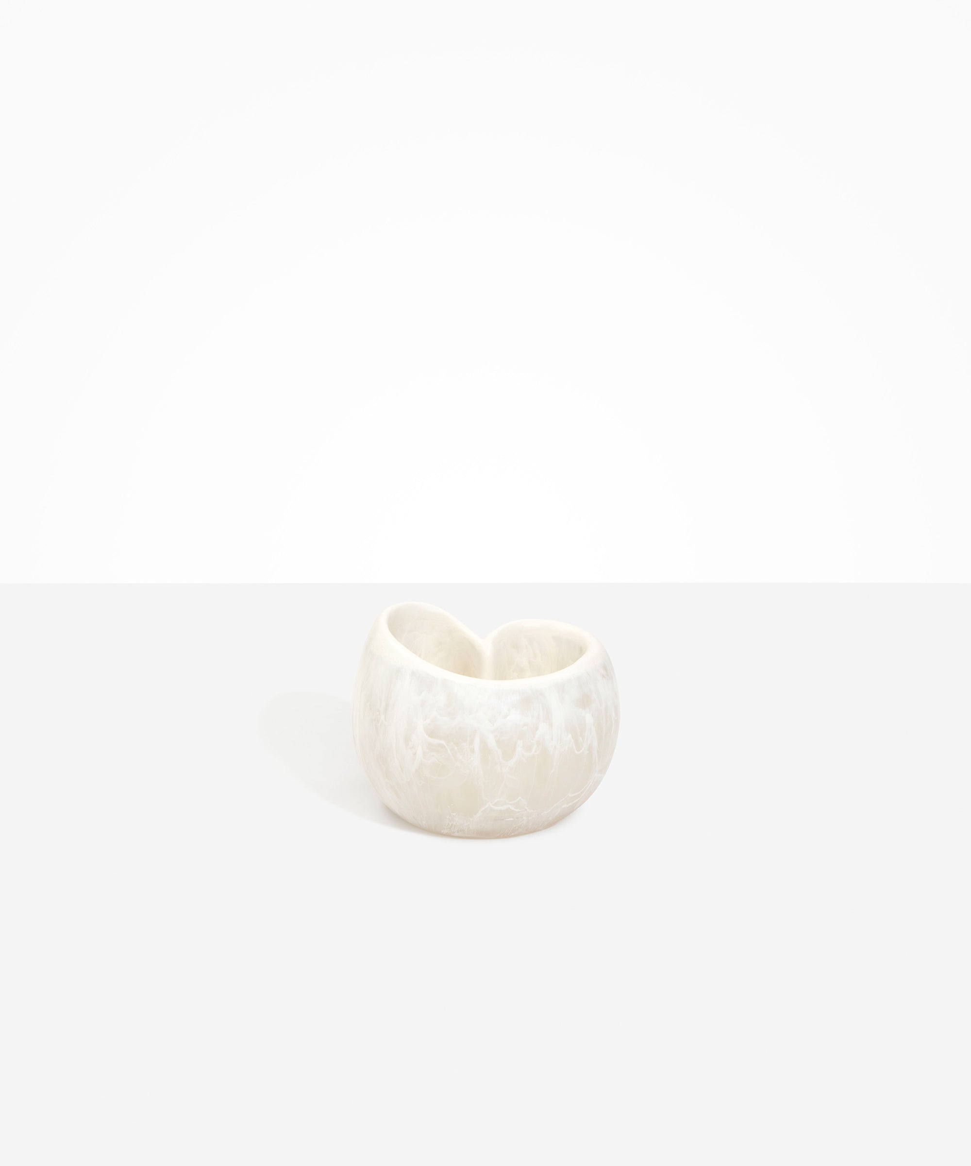 Dinosaur Designs Orchid Vase in Chalk Swirl — handcrafted marbled off-white resin vase with short rounded organic form and sculpted open petal-shaped rim