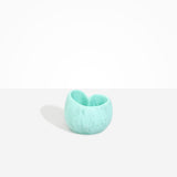 Dinosaur Designs Orchid Vase in Mint — handcrafted marbled mint blue resin vase with short rounded organic form and sculpted open petal-shaped rim