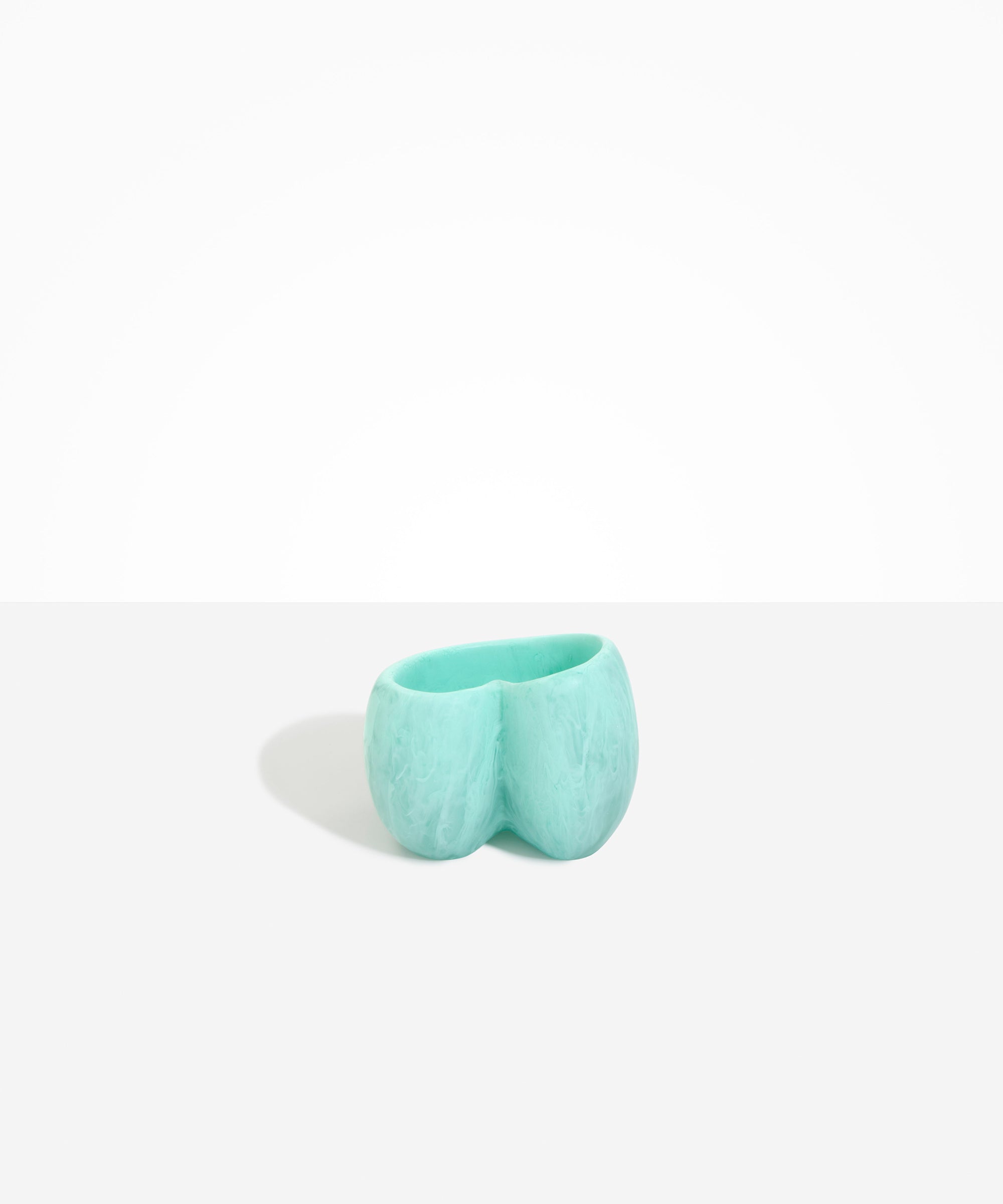 Dinosaur Designs Orchid Vase in Mint — handcrafted marbled mint blue resin vase with short rounded organic form and sculpted open petal-shaped rim