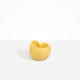 Dinosaur Designs Orchid Vase in Pollen — handcrafted marbled yellow resin vase with short rounded organic form and sculpted open petal-shaped rim