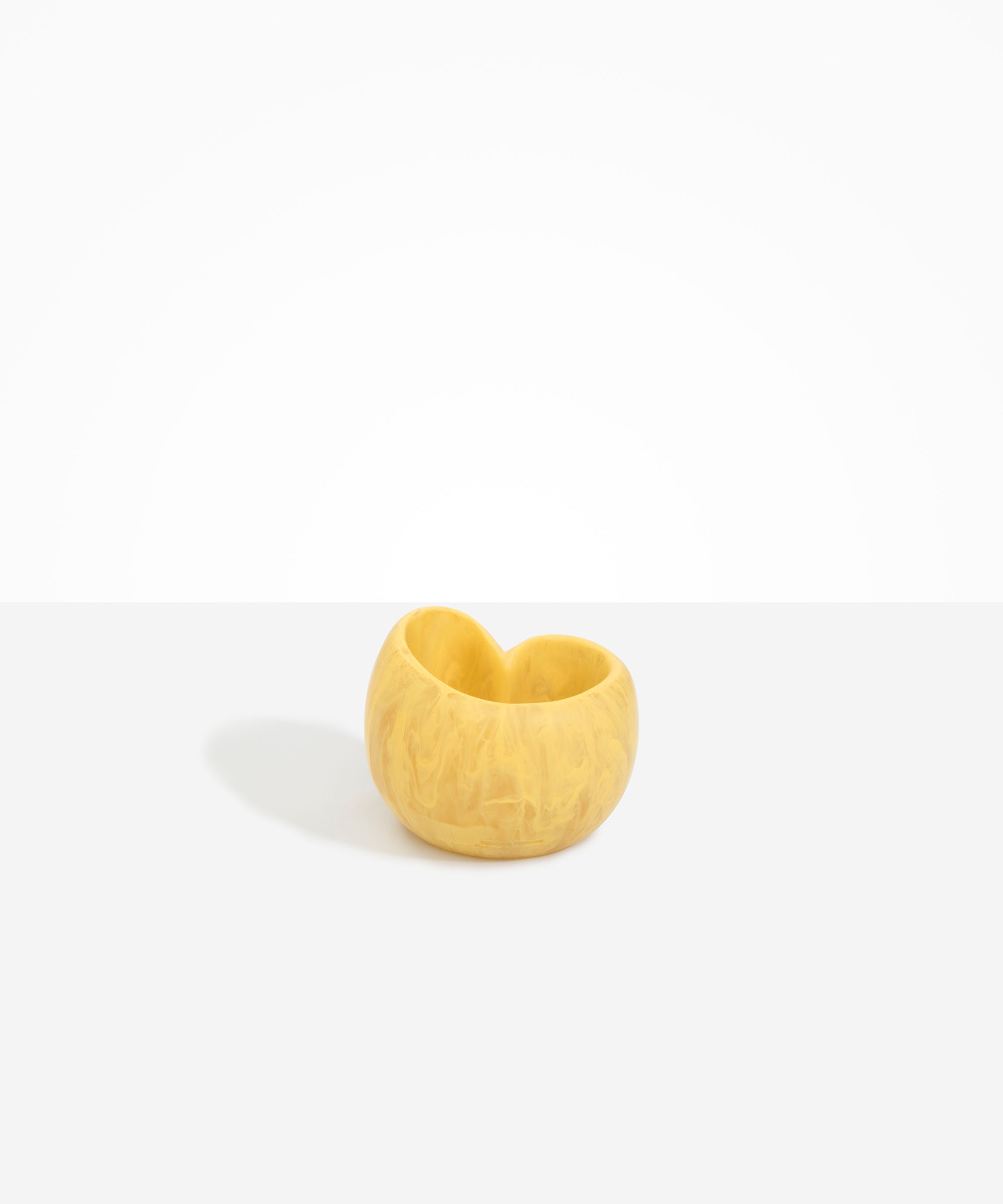 Dinosaur Designs Orchid Vase in Pollen — handcrafted marbled yellow resin vase with short rounded organic form and sculpted open petal-shaped rim