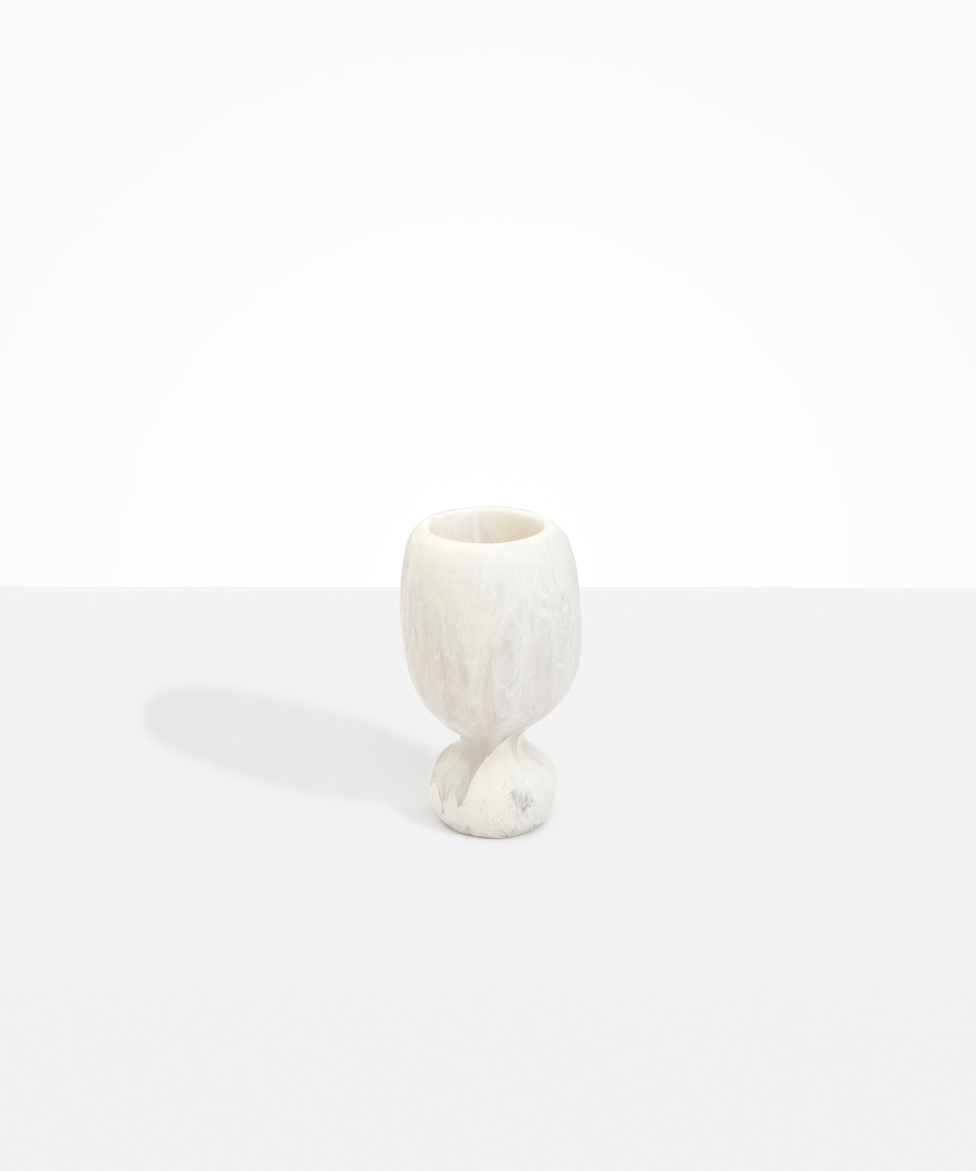 Dinosaur Designs Small Rockpool Vase in Chalk Swirl — handcrafted marbled off-white resin vase with rounded bulbous body and small spherical pedestal base