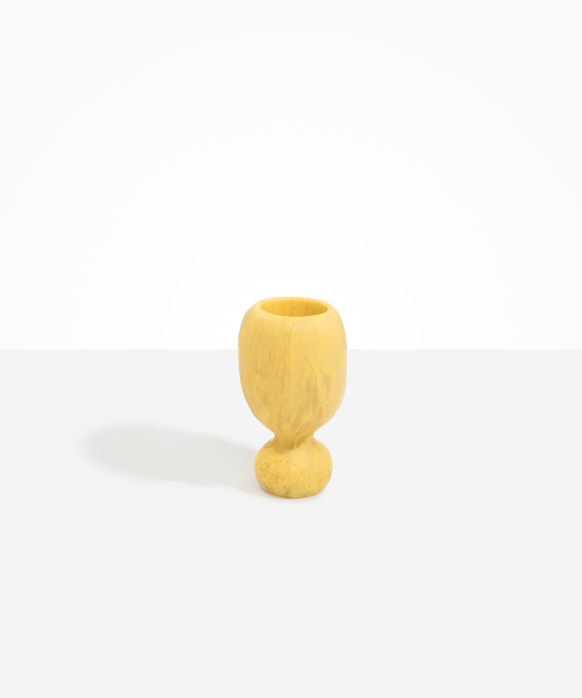 Dinosaur Designs Small Rockpool Vase in Pollen — handcrafted marbled yellow resin vase with rounded bulbous body and small spherical pedestal base