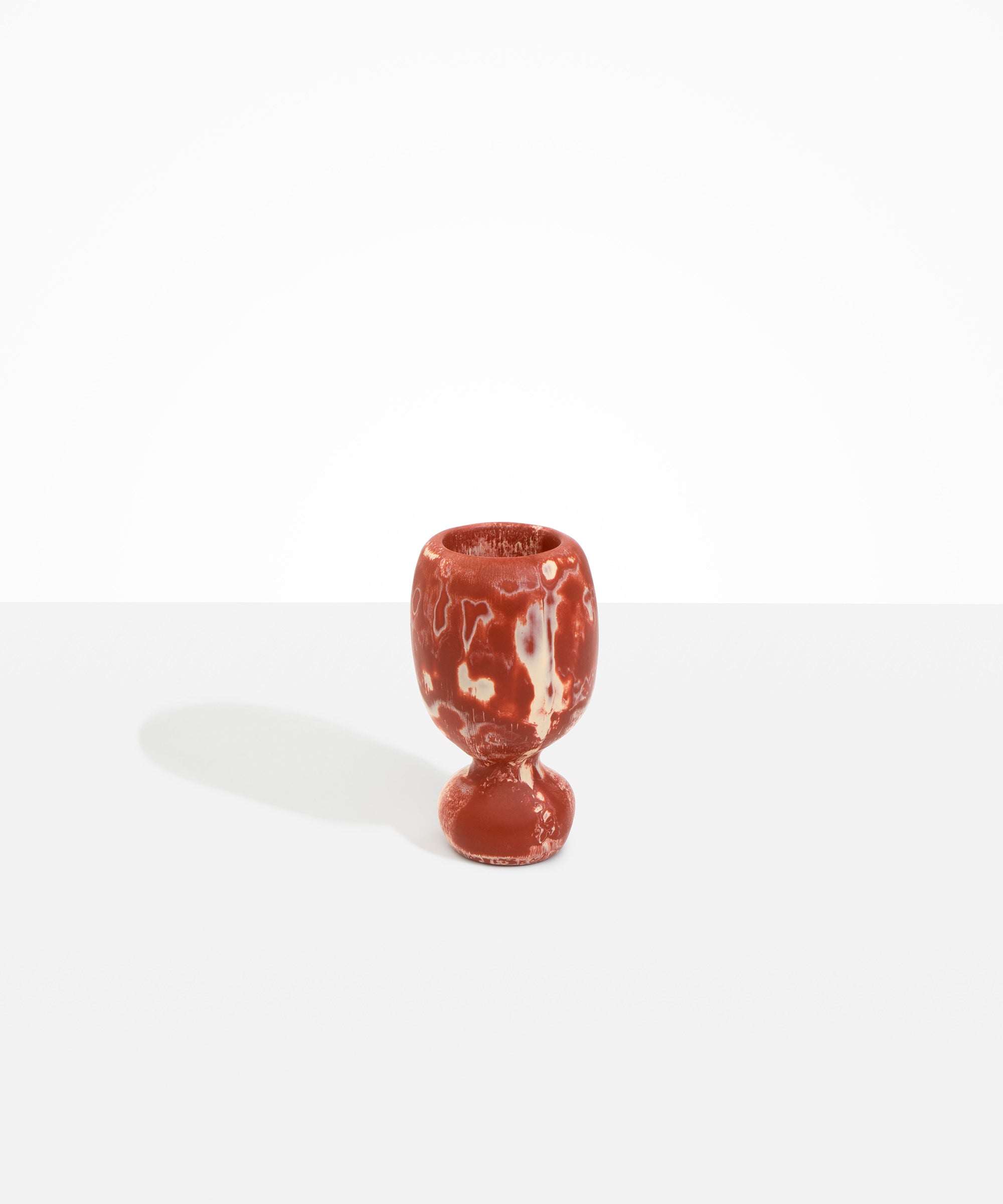 Dinosaur Designs Small Rockpool Vase in Rust — handcrafted marbled terracotta red and cream resin vase with rounded bulbous body and small spherical pedestal base