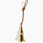 Dinosaur Designs Metal Long Flower Wind Chime in Brass — polished brass cast flower-shaped decorative wind chime with tan leather hanging loop