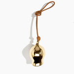 Dinosaur Designs Metal Gumnut Wind Chime in Brass — polished brass cast gumnut-shaped decorative wind chime with tan leather hanging loop