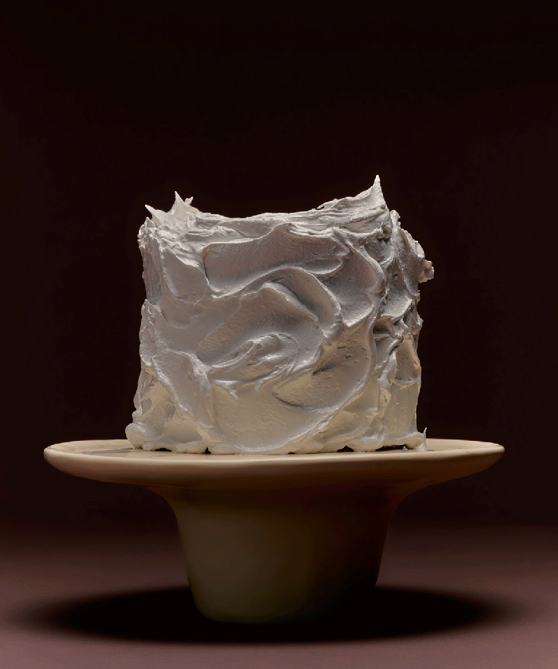 Gif of cream cake stand with cake ontop