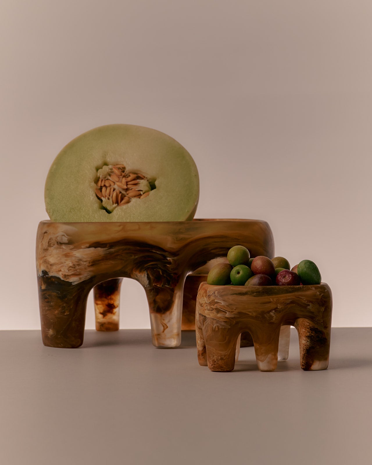 Large brown bowls with variety of fruit
